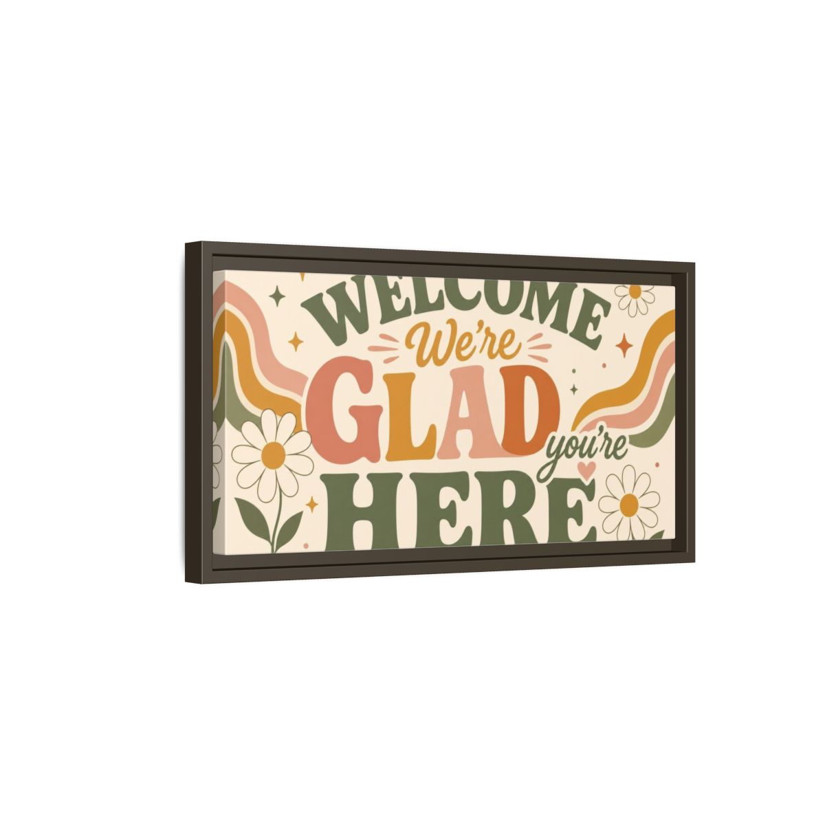 Side Mockup 7. We're Glad You're Here shown as framed canvas print