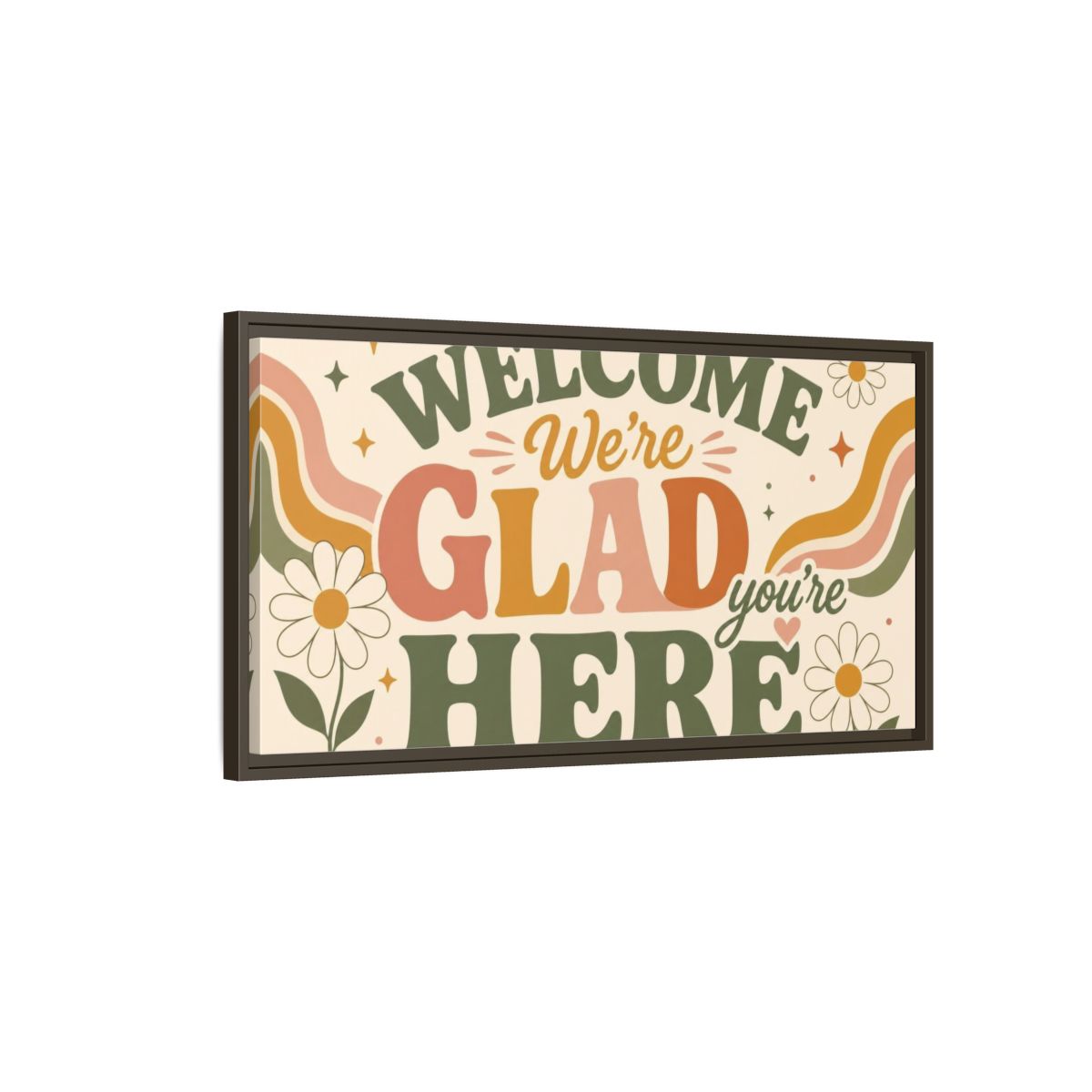 Main Mockup. We're Glad You're Here shown as framed canvas print