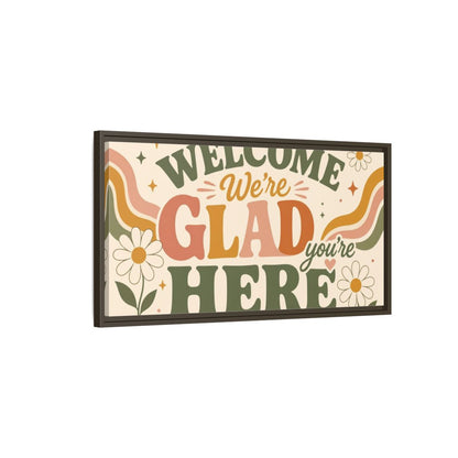 Main Mockup. We're Glad You're Here shown as framed canvas print