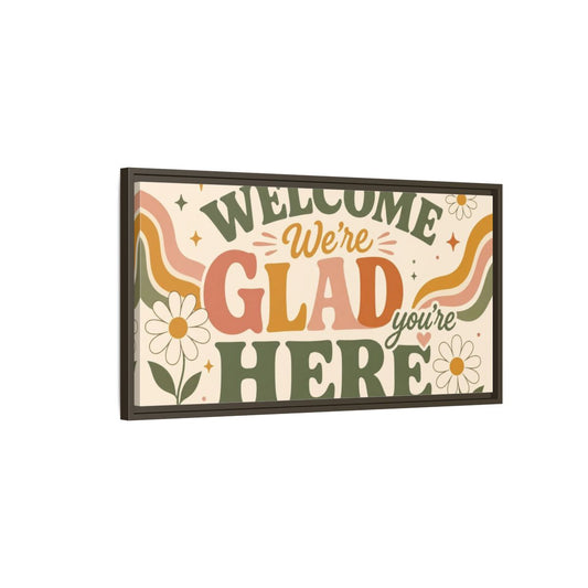 Main Mockup. We're Glad You're Here shown as framed canvas print