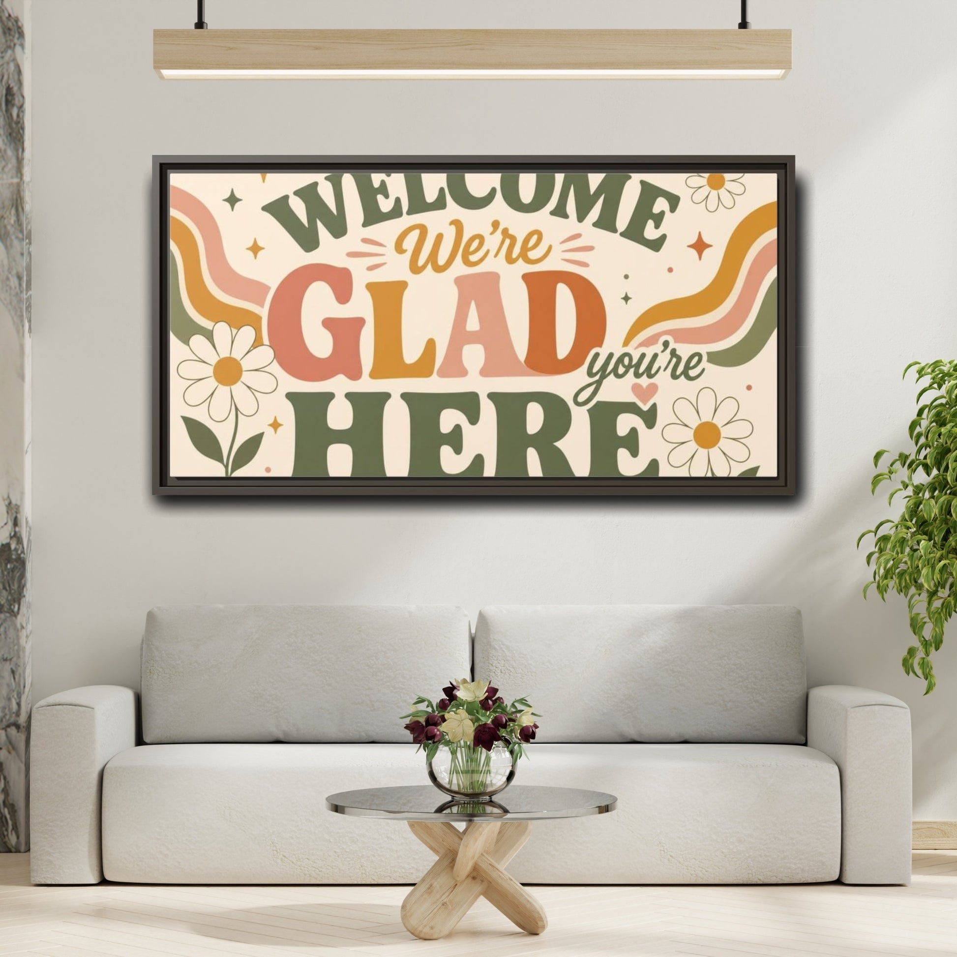 Mockup 2. We're Glad You're Here shown as framed canvas print